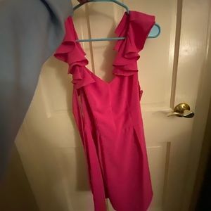 Hot pink formal dress with ruffle shoulders and open back that ties